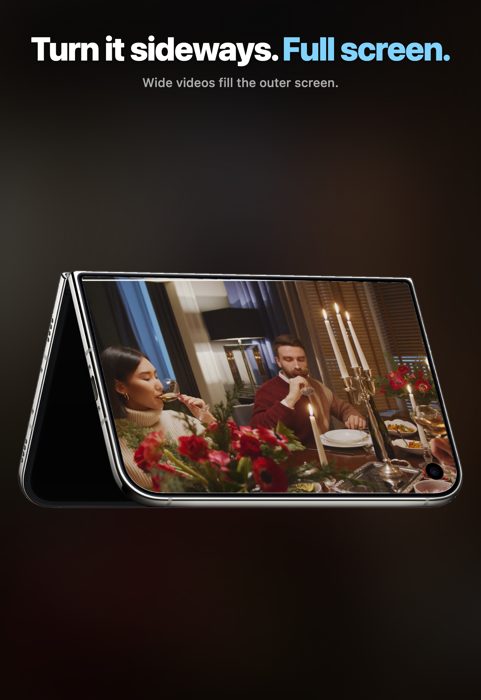 Cloudfull on iPhone Duo standing folded, a wide candlelit dinner video filling the outer screen.